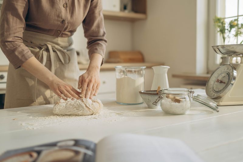 Pizza inn founder crafting handmade pizza dough in Dallas kitchen